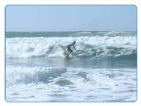 A young man tests the swell of the Atlantic waves